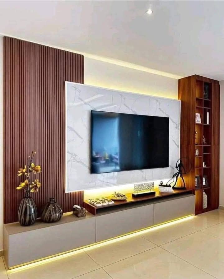 TV feature wall with a marble-effect centre panel, walnut shelving and concealed LED lighting